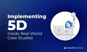 Dark blue slide with the text "Implementing 5D: Inside Real World Case Studies" in white. A line art illustration shows a woman with blue hair sitting at a computer, holding up a white circle with the number 12. The Sparxworks logo is at the bottom right.